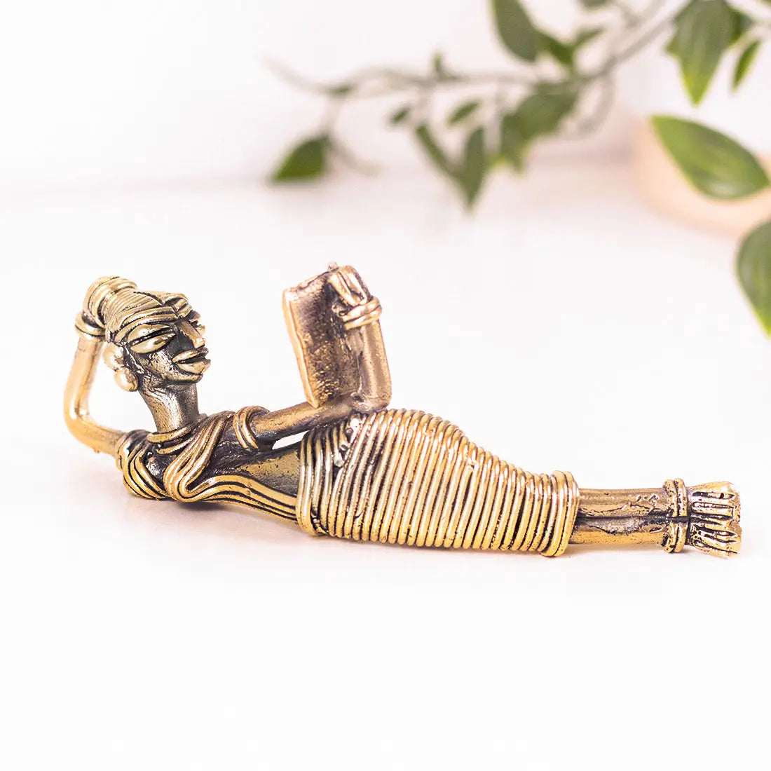 A Leisurely Read Handmade brass figurine in Dhokra art