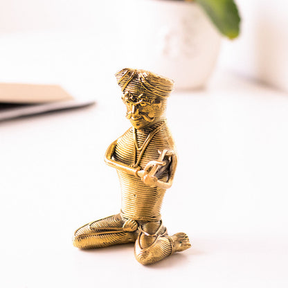 Brass Figurine of a Musician with a Turban